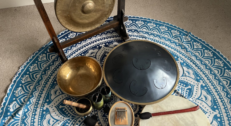 Sound therapy set up with different sound instruments and yoga